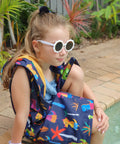 Pool deck coat in dinosaur print. Schmik swim robe in dinosaur print sold by shopify and amazon.com