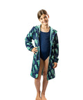 Child wearing swimmers and a schmik swim parka with jellyfish print. 