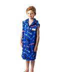 7 year old boy wearing a size 10 fishbone print swim parka. Swim parka has its arms removed.