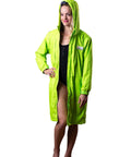 Lady wearing schmik fluro green swim parka. swim parka has  fitted hood and is on the ladies head. 